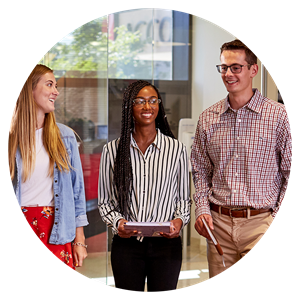 Three interns walking and talking